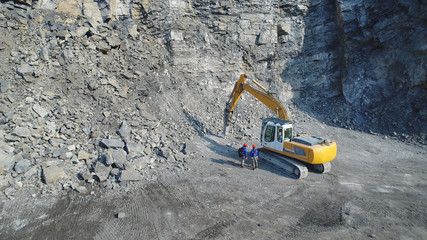 Working in Gravel pit with excavator