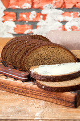 Freshly baked homemade artisan sourdough rye and white flour bread. Sliced. Close up. Copy space.