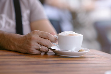 man hand with cup of coffee