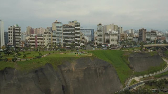 Lima Peru Aerial v32 Flying low backwards away from cliff side parks and paragliding launch area.