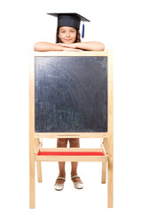 Girl leaning on blackboard