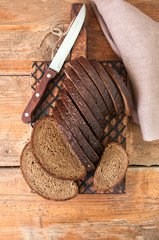 Freshly baked homemade artisan sourdough rye and white flour bread. Sliced. Top view. Close up. Copy space. 