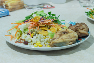 Delicious salad with chicken, nuts, egg and vegetables.