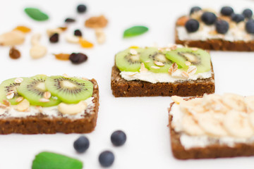 Breakfast. Muesli, nuts and berries. preparation. Granola with fresh berries in jar on stone background. Healthy food and Clean Eating concept