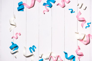 Celebration Flat lay with colorful party items on wooden background.