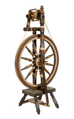 Old spinning wheel isolated on white