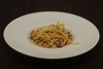 Italian carbonara pasta on white plate
