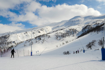 Bakuriani ski resort, Georgia Caucasus mountains 14.02.2017. Didveli ski track, cable car and blue sunny sky