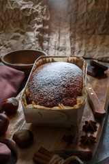 cake with powdered sugar on a brown background. Food shot with retro toning.