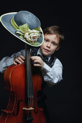 Fototapeta premium portrait of a boy with cello