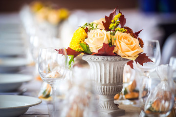 Beautiful restaurant interior table decoration for wedding or event. Flower Wedding Table Decoration/ Autumn colors.