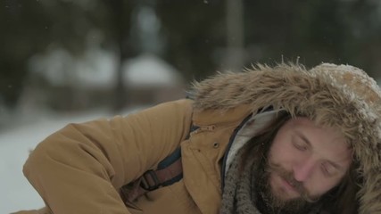 traveler on the nature of the winter falls in the snow