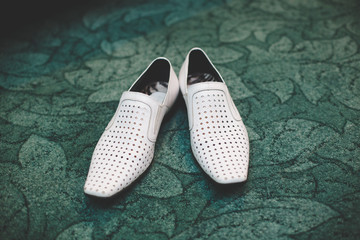 Pair of classic white leather male shoes