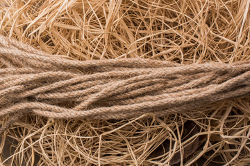 Bundle of linen rope  in straw background