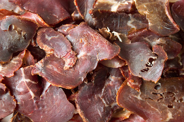 Smoked prosciutto ham on a pile