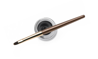 Eyeliner and brush isolated on white 