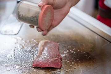 cooking beef steak on pan