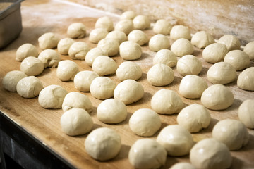 Fototapeta na wymiar Lumps of dough for bread baking