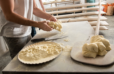 Male baker working with dough