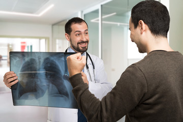 Doctor showing a radiography to a patient