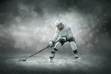 Ice hockey player on the ice, outdoors