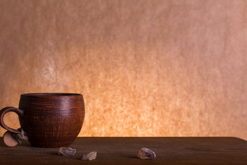 Coffee cup and  brown sugar wooden background. Vintage color tone
