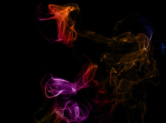 Colored smoke on a black background. Abstract flower
