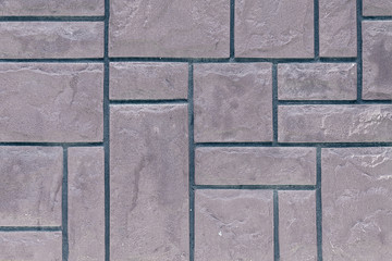 wall background of gray rectangular stones closeup