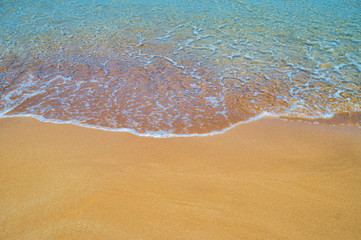 Yellow sand beach close up summer background.