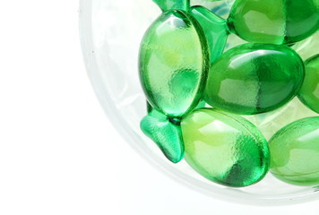 The green color vitamin capsule represent the medicine and healthcare concept related idea.