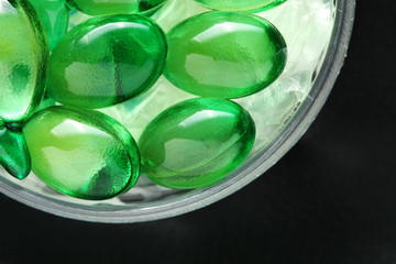 The green color vitamin capsule represent the medicine and healthcare concept related idea.