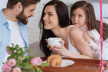 Attractive young woman holding a cup