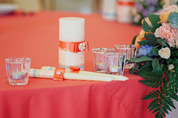 Wedding candles decorated with bow and ribbons