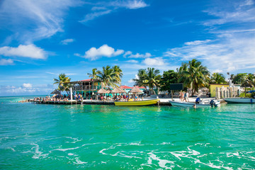 Beautiful  caribbean sight with turquoise water in Caye Caulker, Belize. - obrazy, fototapety, plakaty