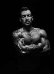 Fototapeta premium Strong athletic man showes naked muscular body