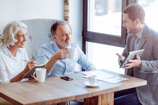 Positive Aged Couple Meeting With Sales Manager