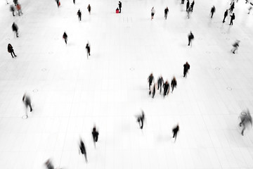 Top view people walking white floor in motion blur
