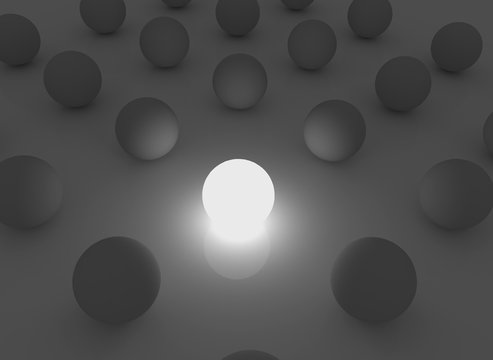 Abstract spheres in the darkness illuminated with one light sphere.
