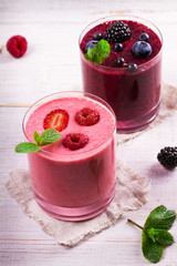 Summer berries smoothie garnished with mint