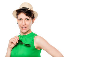 Young slim woman with stylish accessories on a white background