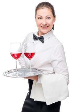 portrait of a woman - a waitress with glasses of wine on a white background in studio
