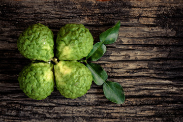 Kaffir lime fruit on wooden background