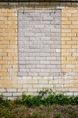 Old wall with bricked up windows