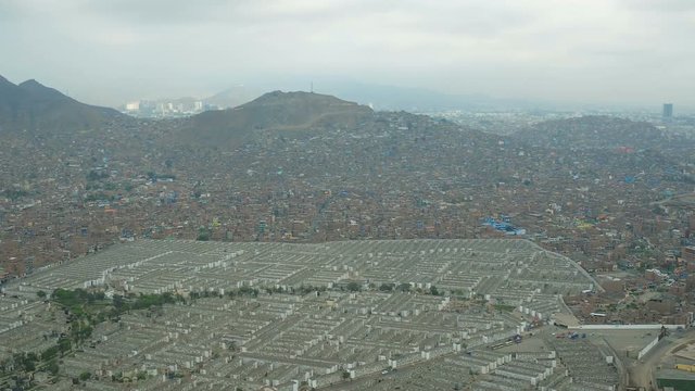Lima Peru Aerial v47 Flying near large cemetery in El Agustino district panning with panoramic views.