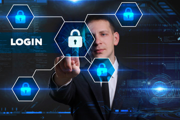 Business, Technology, Internet and network concept. Young businessman working on a virtual blackboard of the future, he sees the inscription: login
