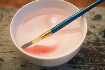 Brush closeup dip with watercolor paint