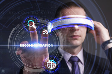 Business, Technology, Internet and network concept. Young businessman working in virtual reality glasses sees the inscription: Recommendation
