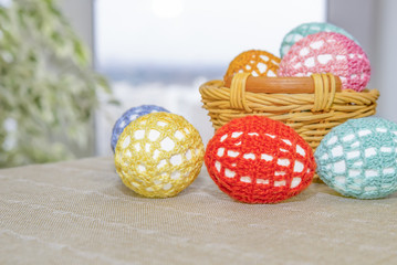 Easter eggs are in lacy multi-colored clothes