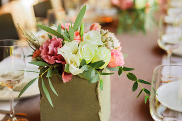 Served wedding table with flowers decorations