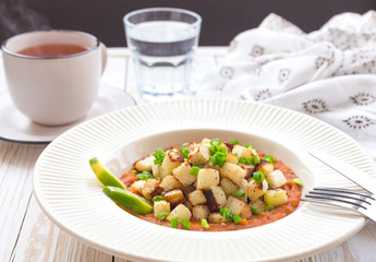 Stewed kohlrabi cabbage with lime and tomato sause